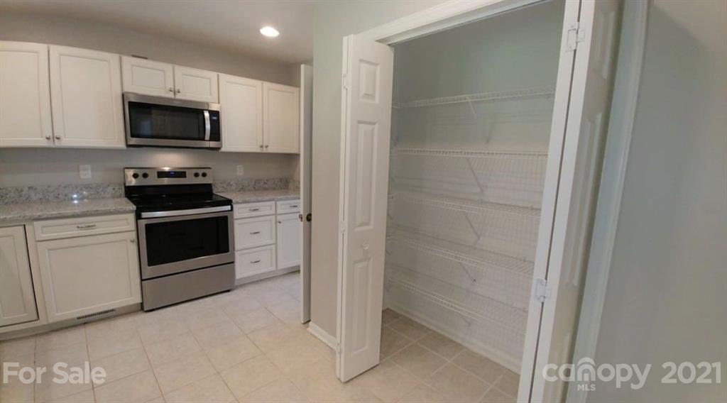 6517 Park Road Charlotte, NC 28210 - Photo 4 of 20 a kitchen with a stove and a microwave