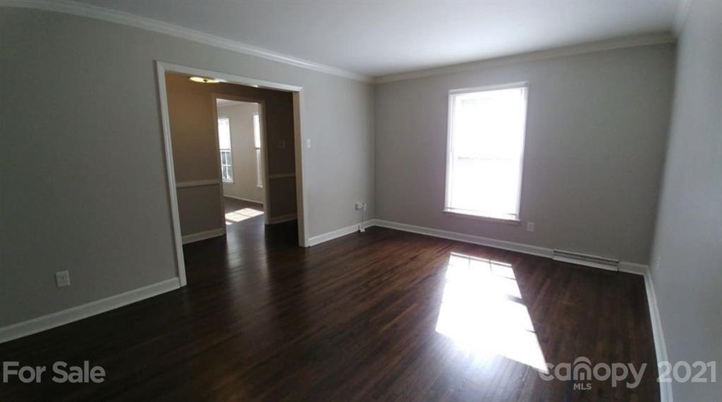 6517 Park Road Charlotte, NC 28210 - Photo 7 of 20 wooden floor in an empty room with a window