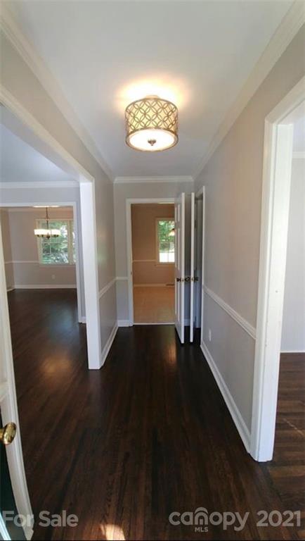 6517 Park Road Charlotte, NC 28210 - Photo 8 of 20 wooden floor in an empty room with a window