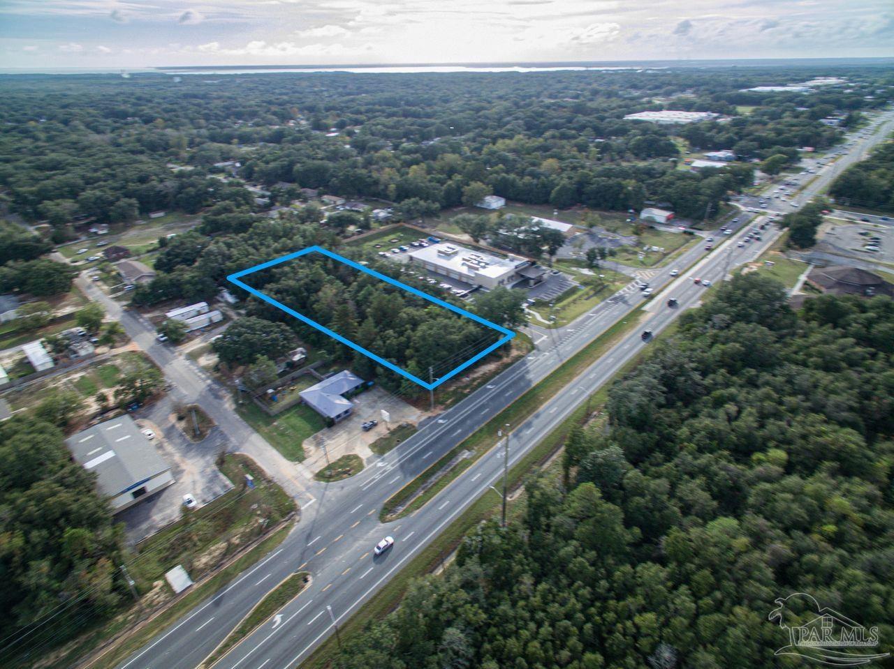 5321 Highway 90 Pace, FL 32571 - Photo 4 of 7 an aerial view of residential houses with outdoor space