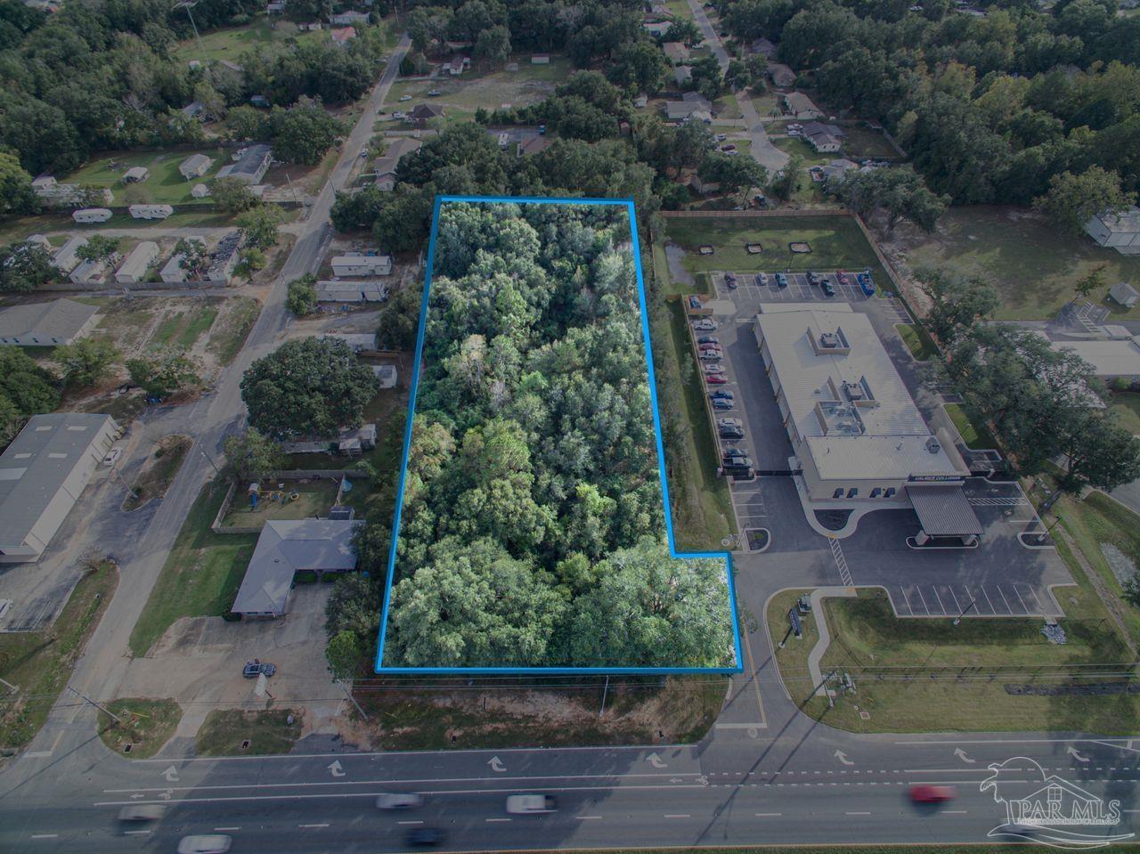 5321 Highway 90 Pace, FL 32571 - Photo 6 of 7 an aerial view of a house with a yard