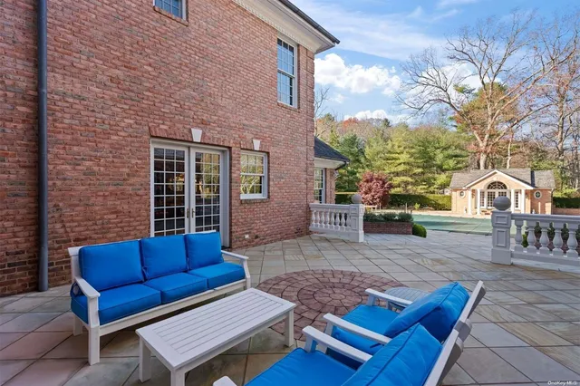a view of house with outdoor seating