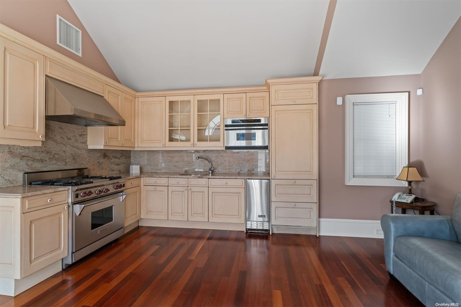 660 Chicken Valley Road Locust Valley, NY 11560 - Photo 30 of 50 a kitchen with wooden floors and appliances