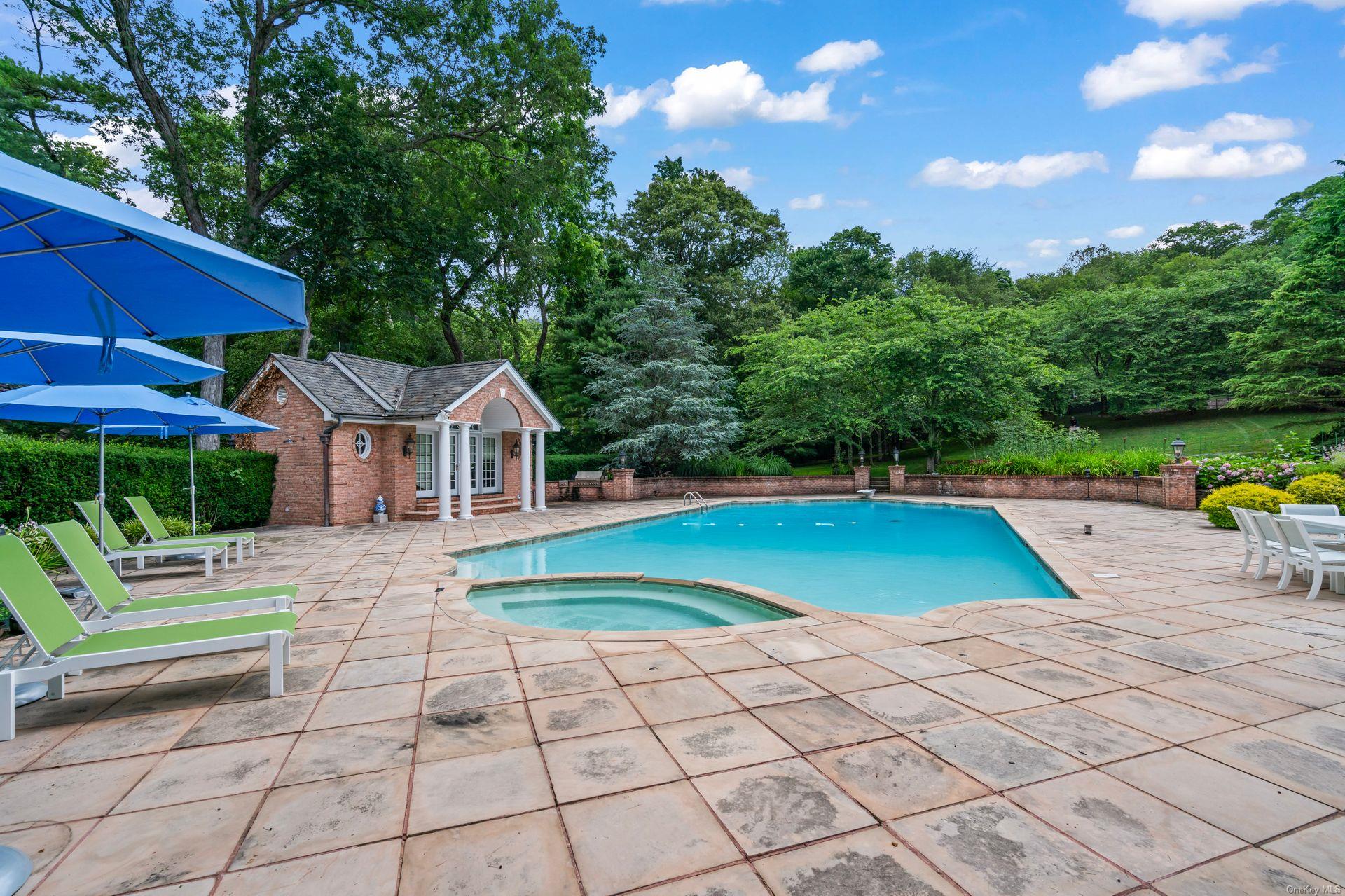 660 Chicken Valley Road Locust Valley, NY 11560 - Photo 46 of 50 a view of house with outdoor space and swimming pool