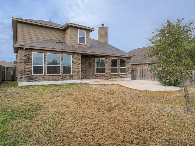a house with trees in front of it