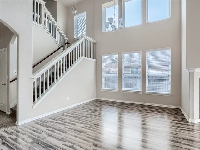 a view of an entryway with wooden floor