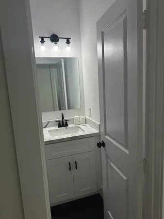 a bathroom with a toilet and a bath tub