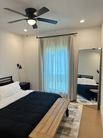 a bedroom with a bed and a large walk in closet