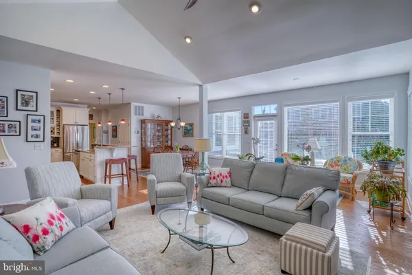 a kitchen with stainless steel appliances granite countertop a refrigerator a sink and a stove