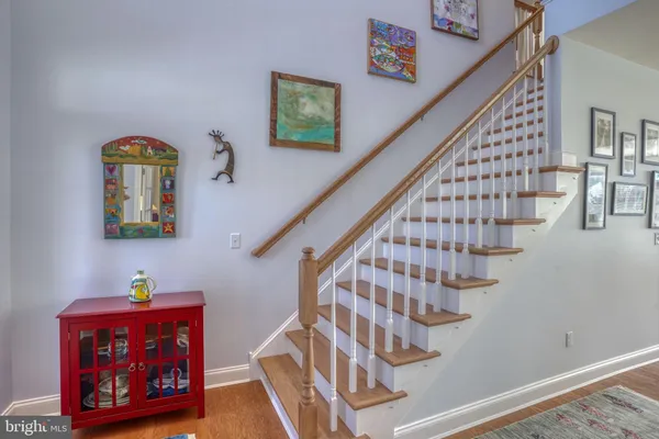 a view of a patio with table and chairs and potted plants