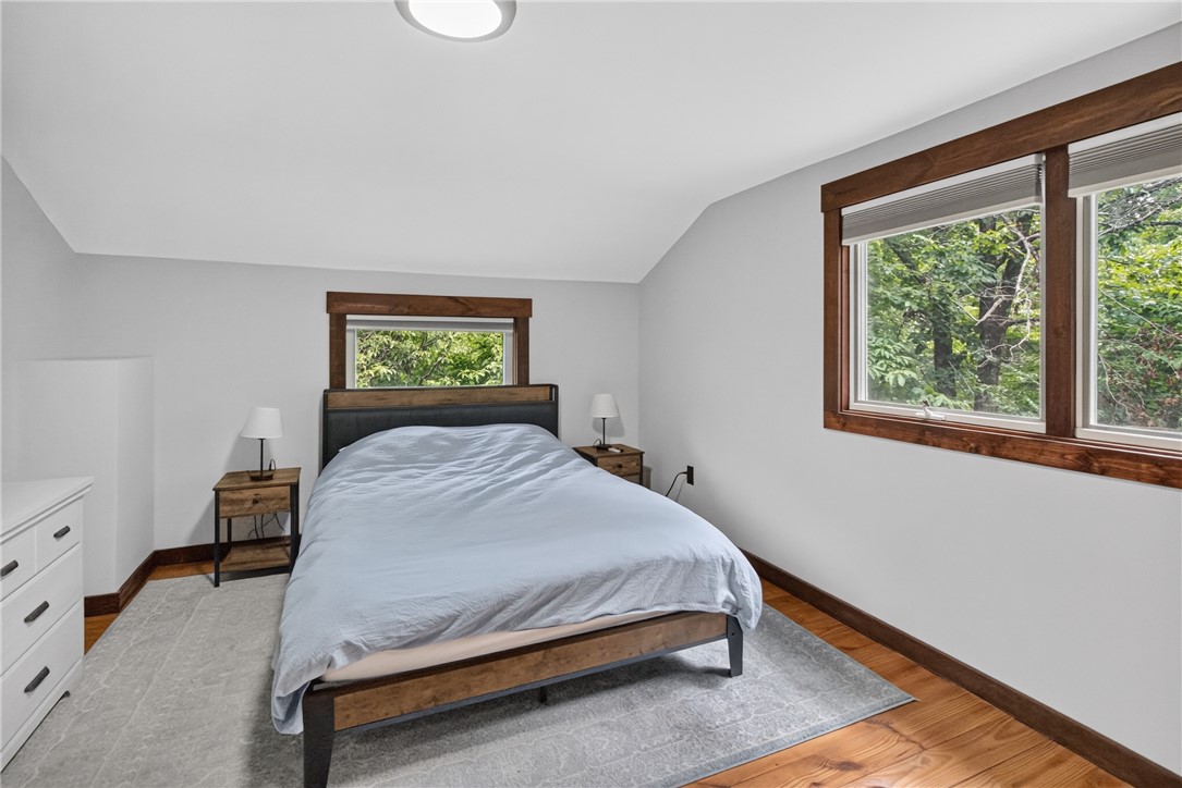 130 Maggie Rufus Lane Westminster, SC 29693 - Photo 23 of 50 Hardwood floors and natural wood window trim bring warmth to this tranquil, sunlit bedroom.