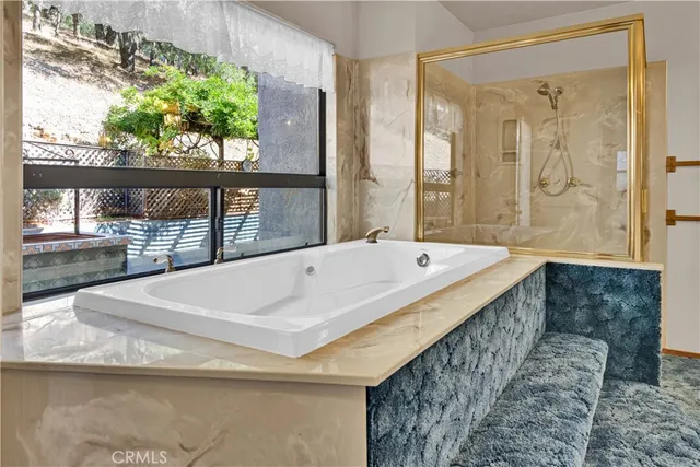 a bath tub sitting next to a window
