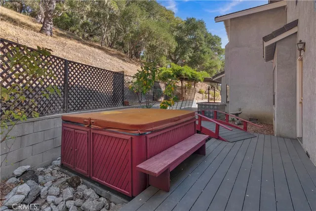 a wooden bench sitting in front of a building