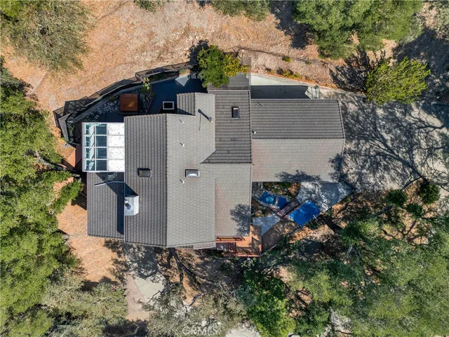 a view of a house with a yard and a tree