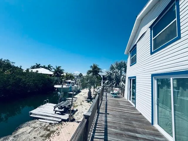 a view of a balcony with chairs