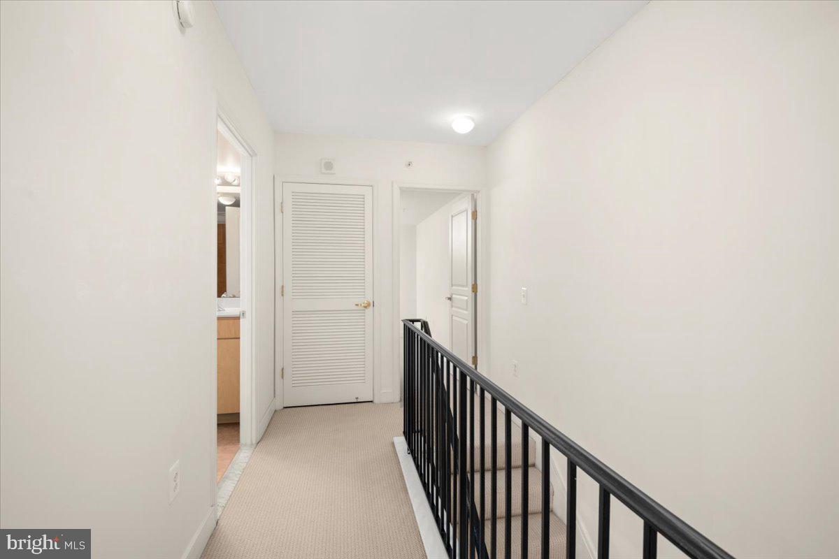 616 E Street Northwest, Unit 455 Washington, DC 20004 - Photo 32 of 75 2nd Floor Landing with W/D Closet