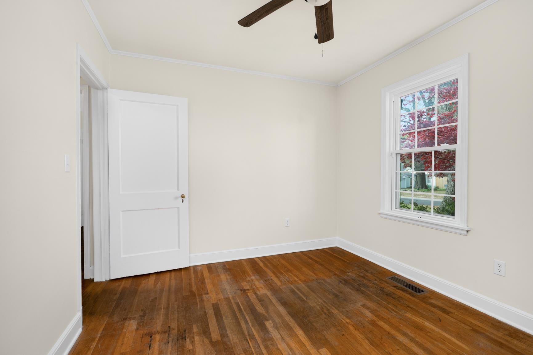 22 North Humes Street Memphis, TN 38111 - Photo 14 of 23 an empty room with wooden floor cabinet and windows
