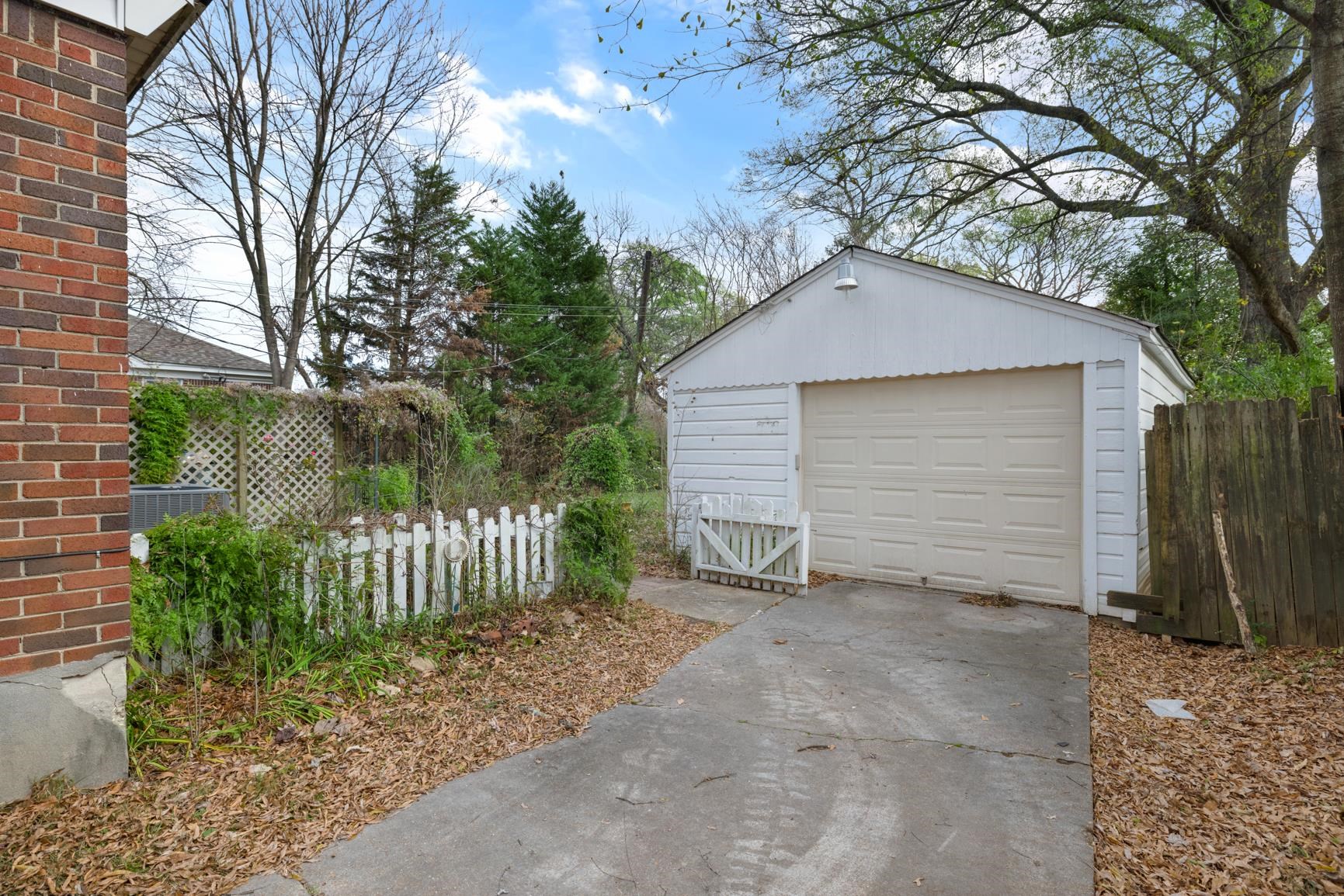 22 North Humes Street Memphis, TN 38111 - Photo 22 of 23 Detached garage with concrete driveway