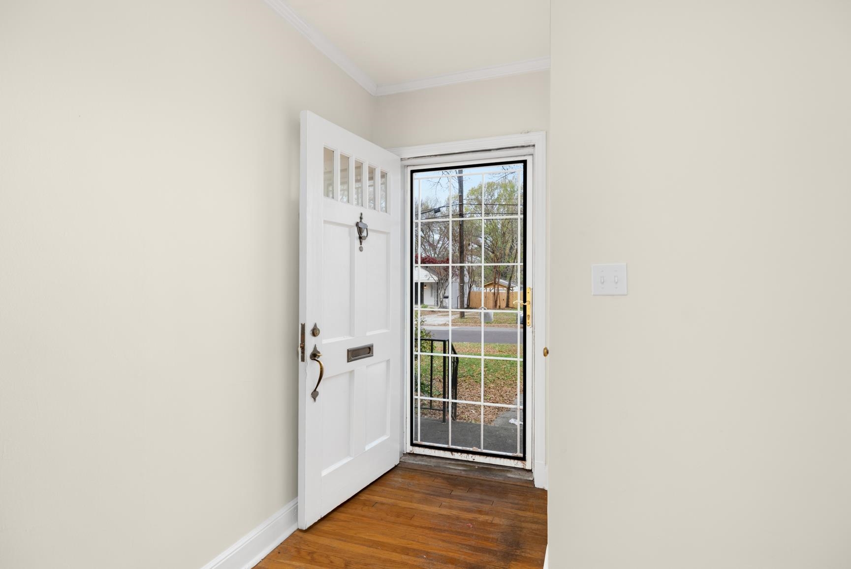 22 North Humes Street Memphis, TN 38111 - Photo 4 of 23 Doorway to outside featuring ornamental molding and wood-type flooring