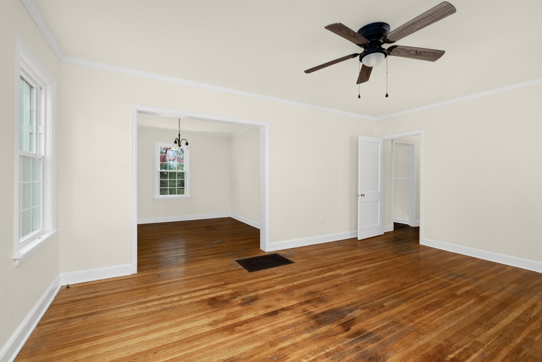 22 North Humes Street Memphis, TN 38111 - Photo 6 of 23 a view of empty room with wooden floor and ceiling fan