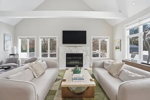 a living room with furniture and a table