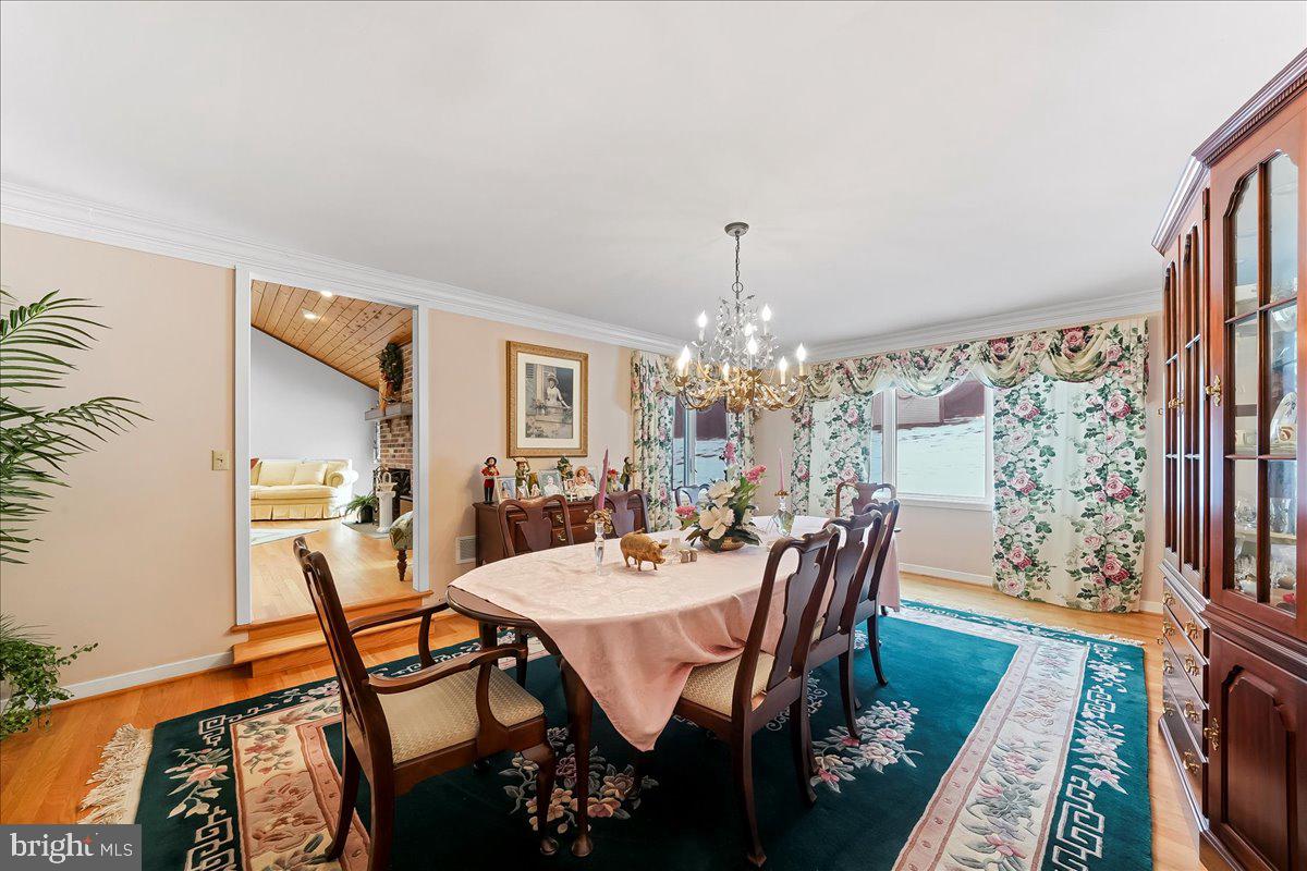 531 Chandler Mill Road Kennett Square, PA 19348 - Photo 20 of 60 a view of a dining room with furniture and chandelier