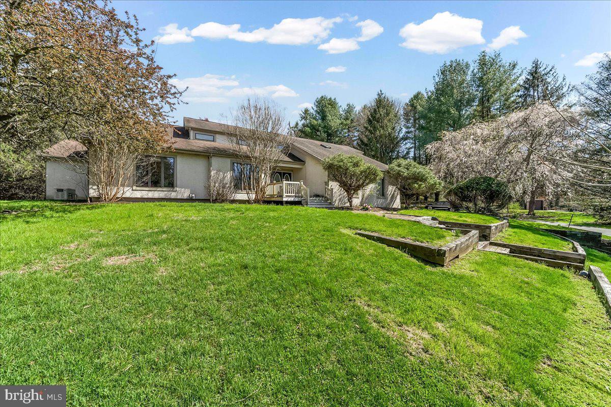 531 Chandler Mill Road Kennett Square, PA 19348 - Photo 2 of 60 a view of a house with a big yard and large trees