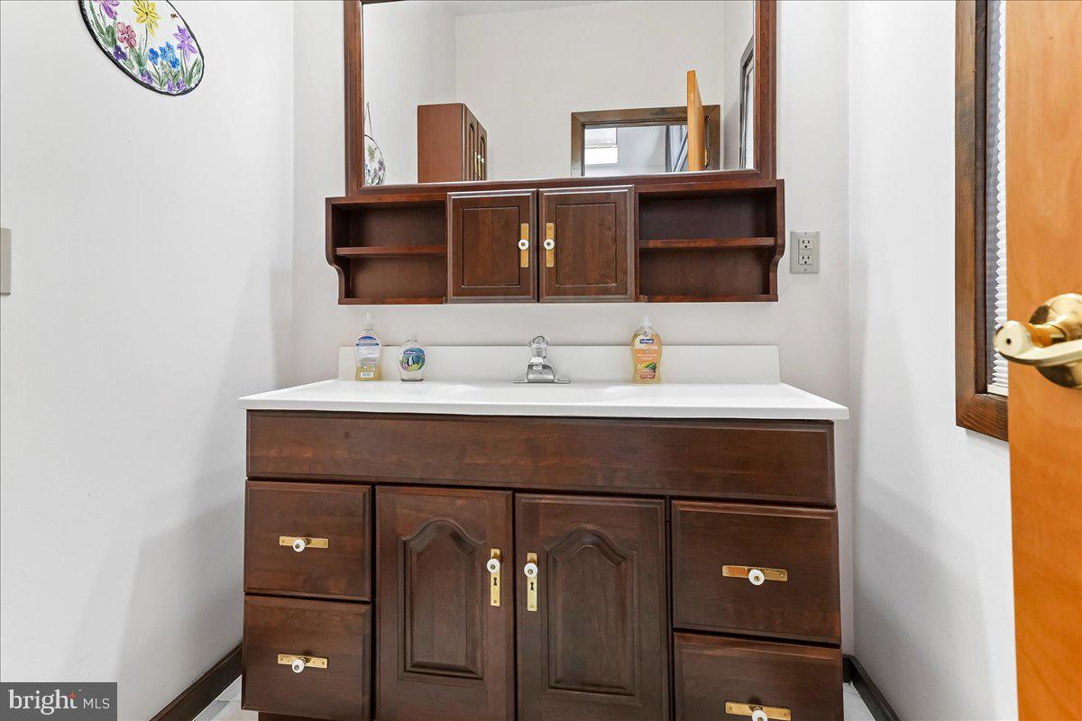 531 Chandler Mill Road Kennett Square, PA 19348 - Photo 31 of 60 a bathroom with a sink vanity and a mirror