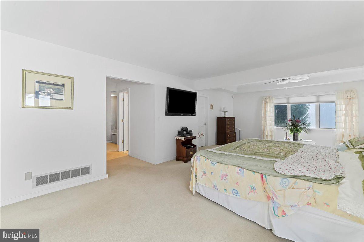 531 Chandler Mill Road Kennett Square, PA 19348 - Photo 37 of 60 a bed room with a bed and a television