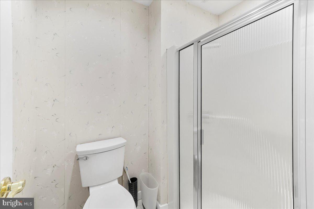 531 Chandler Mill Road Kennett Square, PA 19348 - Photo 41 of 60 a white toilet sitting next to a shower