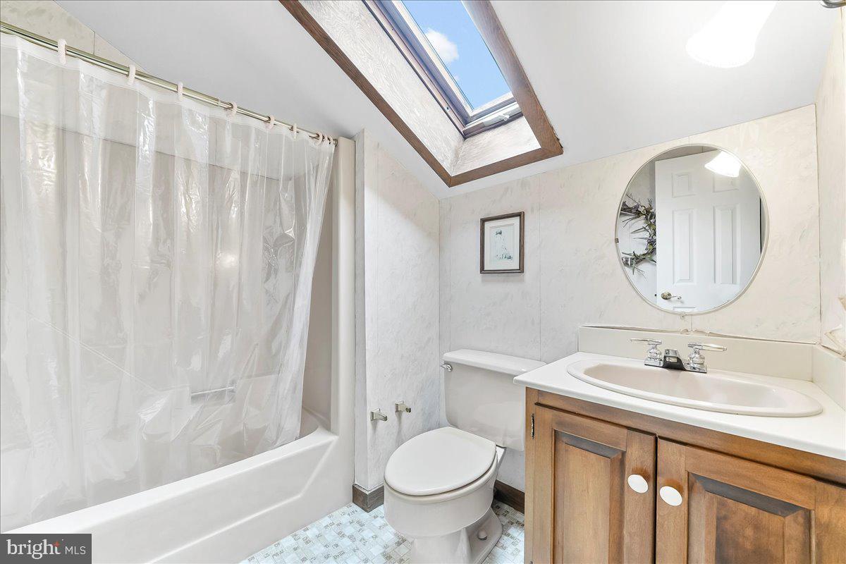 531 Chandler Mill Road Kennett Square, PA 19348 - Photo 50 of 60 a bathroom with a sink toilet and a mirror
