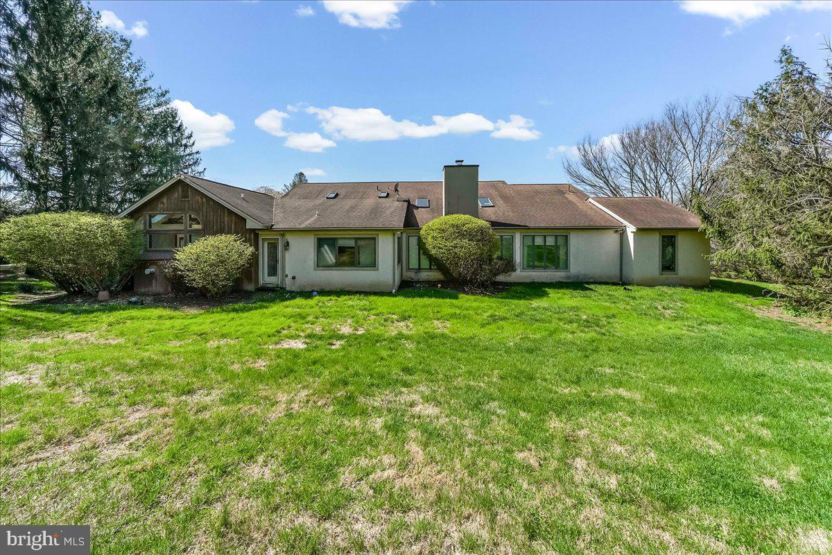 531 Chandler Mill Road Kennett Square, PA 19348 - Photo 5 of 60 a view of a house next to a big yard and large trees