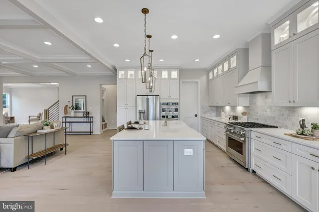 a bathroom with double vanity sinks and a mirror