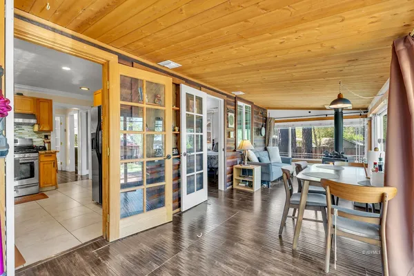 a view of a dining room with furniture window and outside view