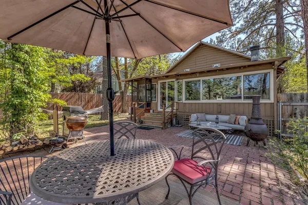 a view of a house with backyard tub and sitting area