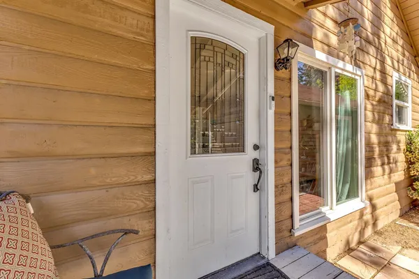 a view of a door and a window
