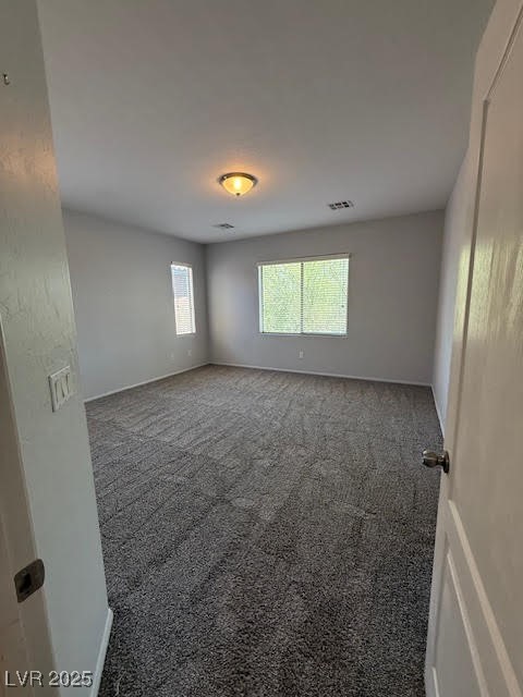 766 Crest Valley Place Henderson, NV 89011 - Photo 10 of 14 Spare room featuring baseboards and carpet