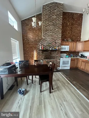 a dining room with a table and chairs