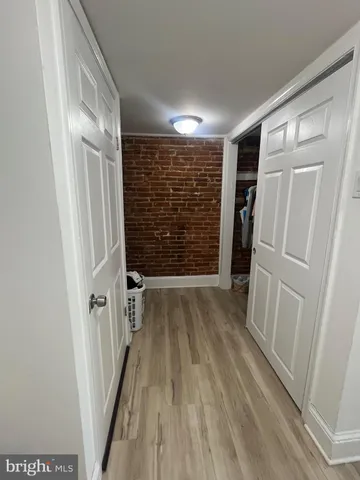 a view of entryway with wooden floor