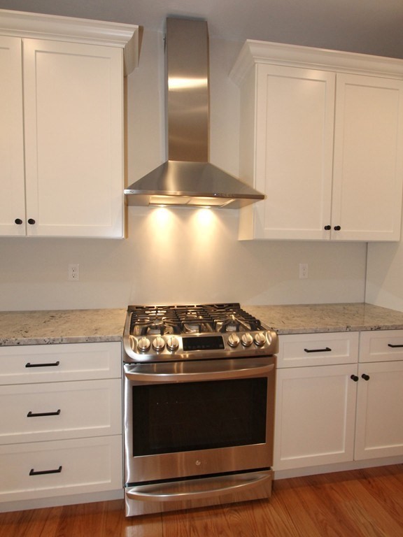 135 South S Road Holden, MA 01520 - Photo 12 of 25 a stove top oven sitting inside of a kitchen