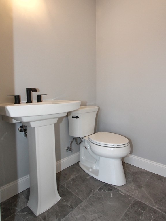 135 South S Road Holden, MA 01520 - Photo 14 of 25 a white toilet sitting next to a white sink