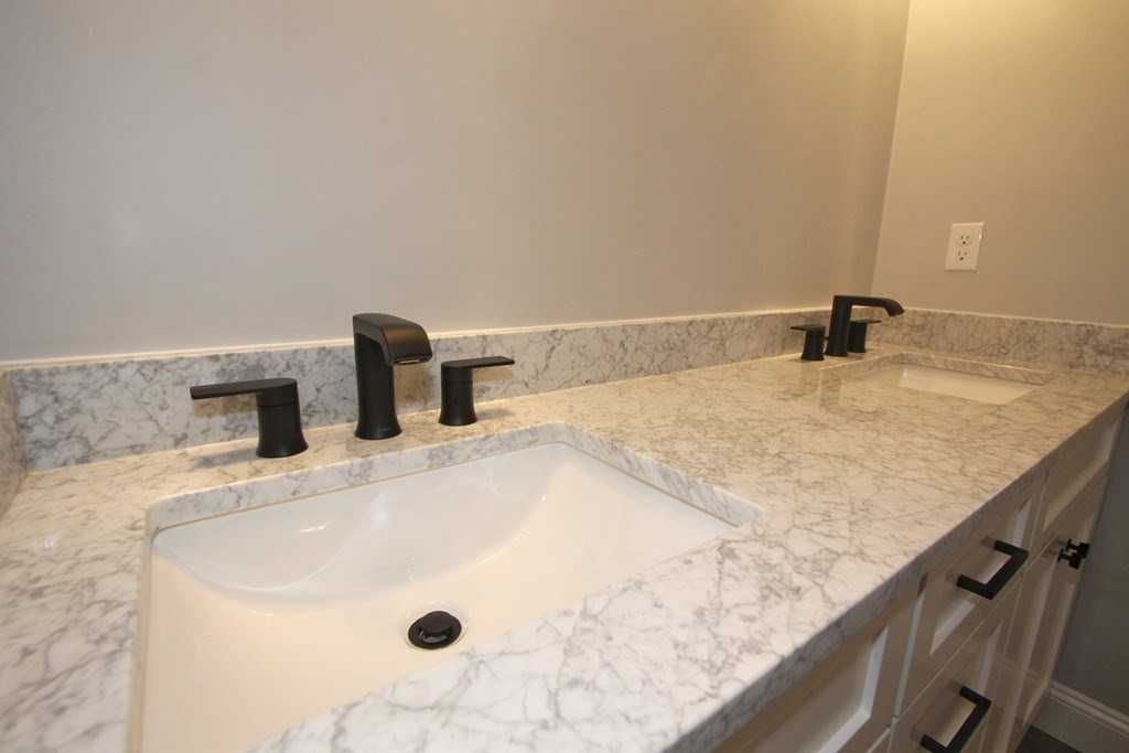 135 South S Road Holden, MA 01520 - Photo 16 of 25 a bathroom with a granite countertop sink and a mirror