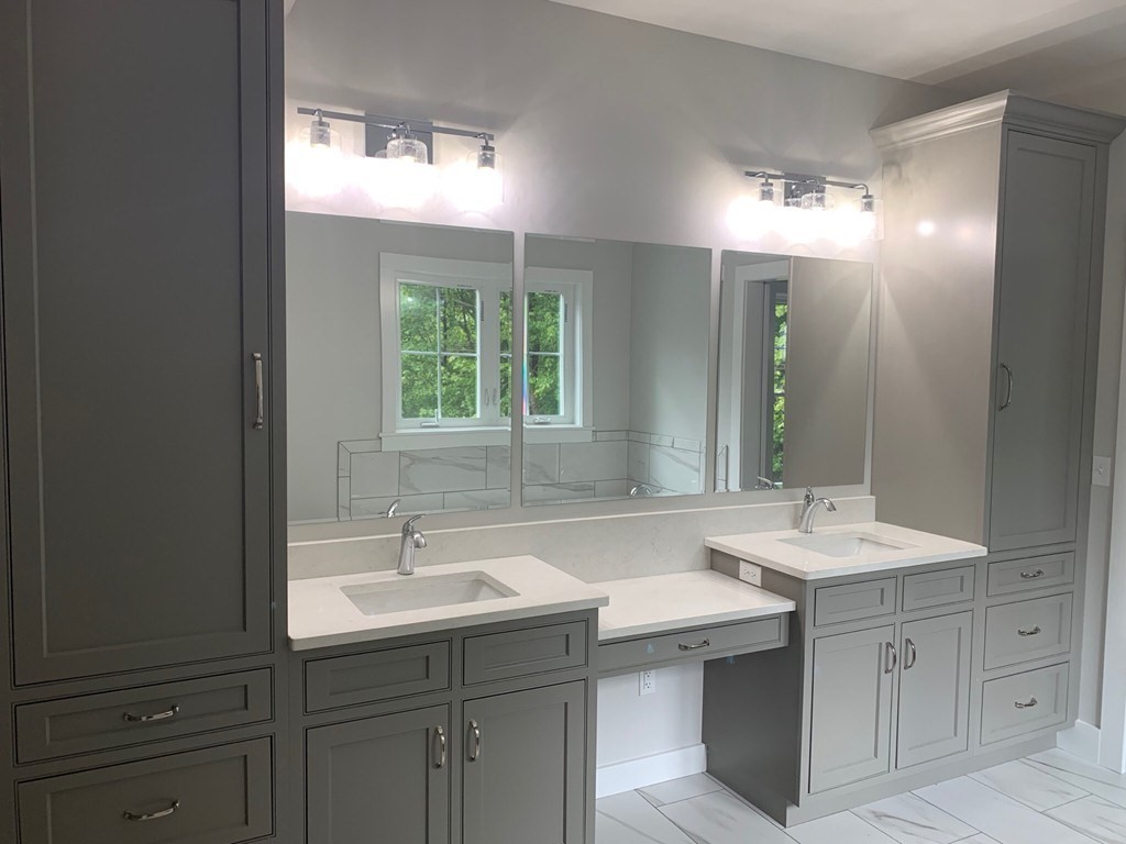 135 South S Road Holden, MA 01520 - Photo 20 of 25 a bathroom with a sink double vanity and a mirror