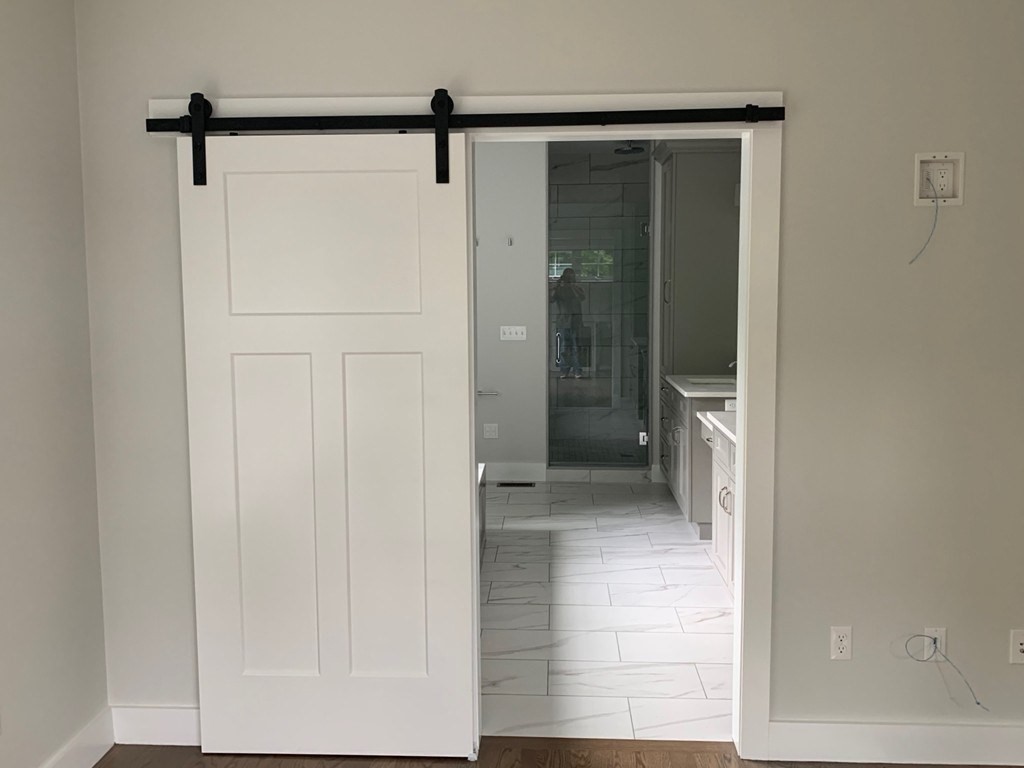 135 South S Road Holden, MA 01520 - Photo 21 of 25 a bathroom with a glass shower door