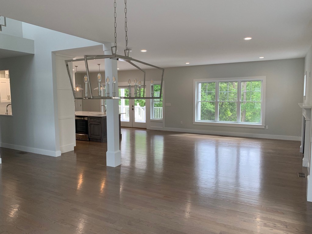 135 South S Road Holden, MA 01520 - Photo 22 of 25 an empty room with wooden floor and windows