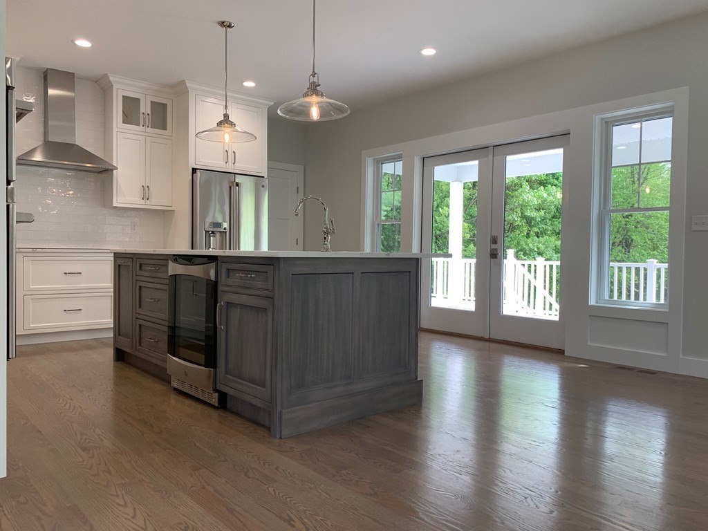 135 South S Road Holden, MA 01520 - Photo 24 of 25 a open kitchen with stainless steel appliances granite countertop a stove a sink a center island and a wooden floor