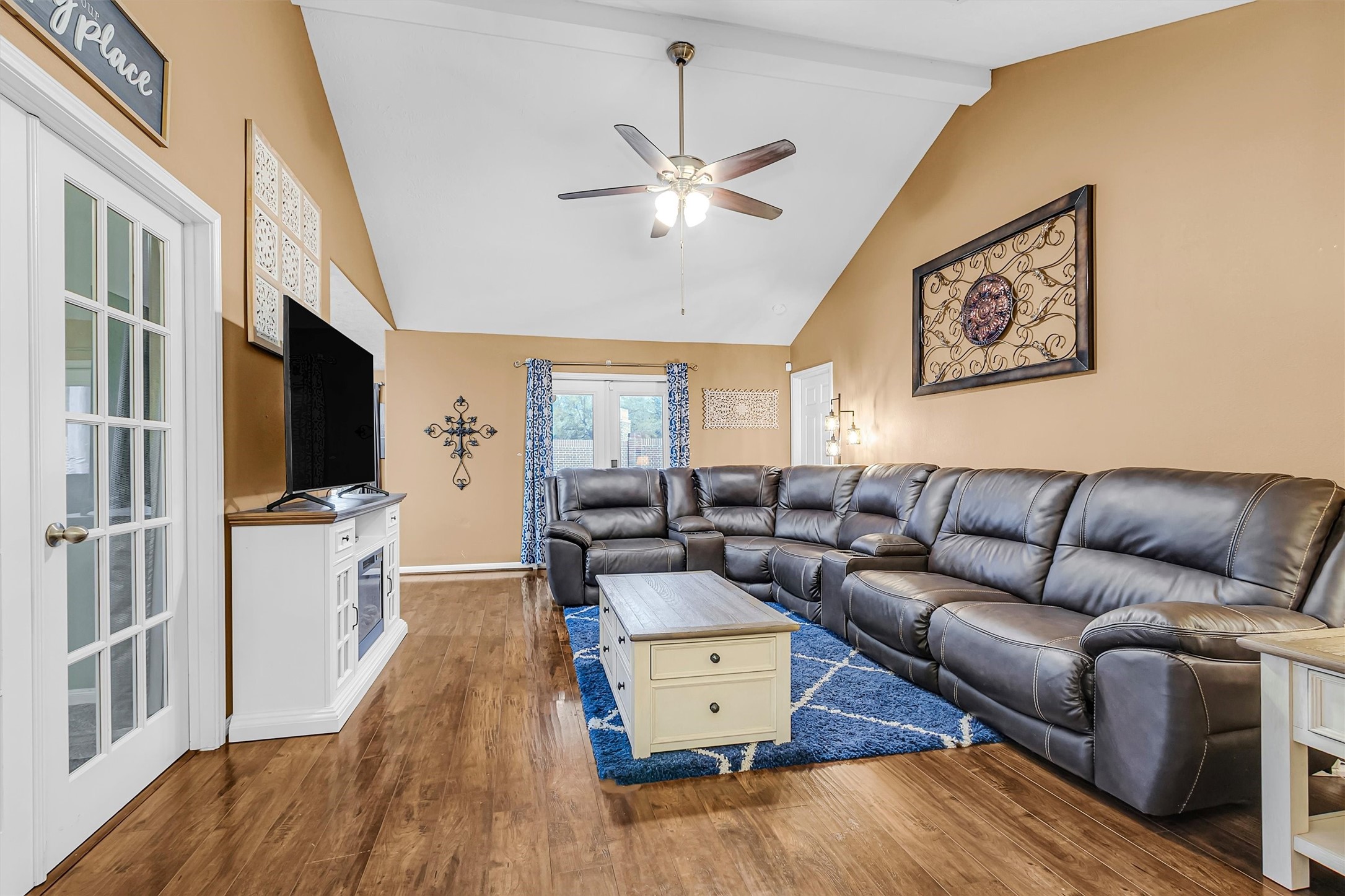 4802 Comal River Loop Spring, TX 77386 - Photo 4 of 20 Looking across the living room from the other direction. High ceilings grace this space for an open feel. Notice another view of the engineered hard wood flooring.