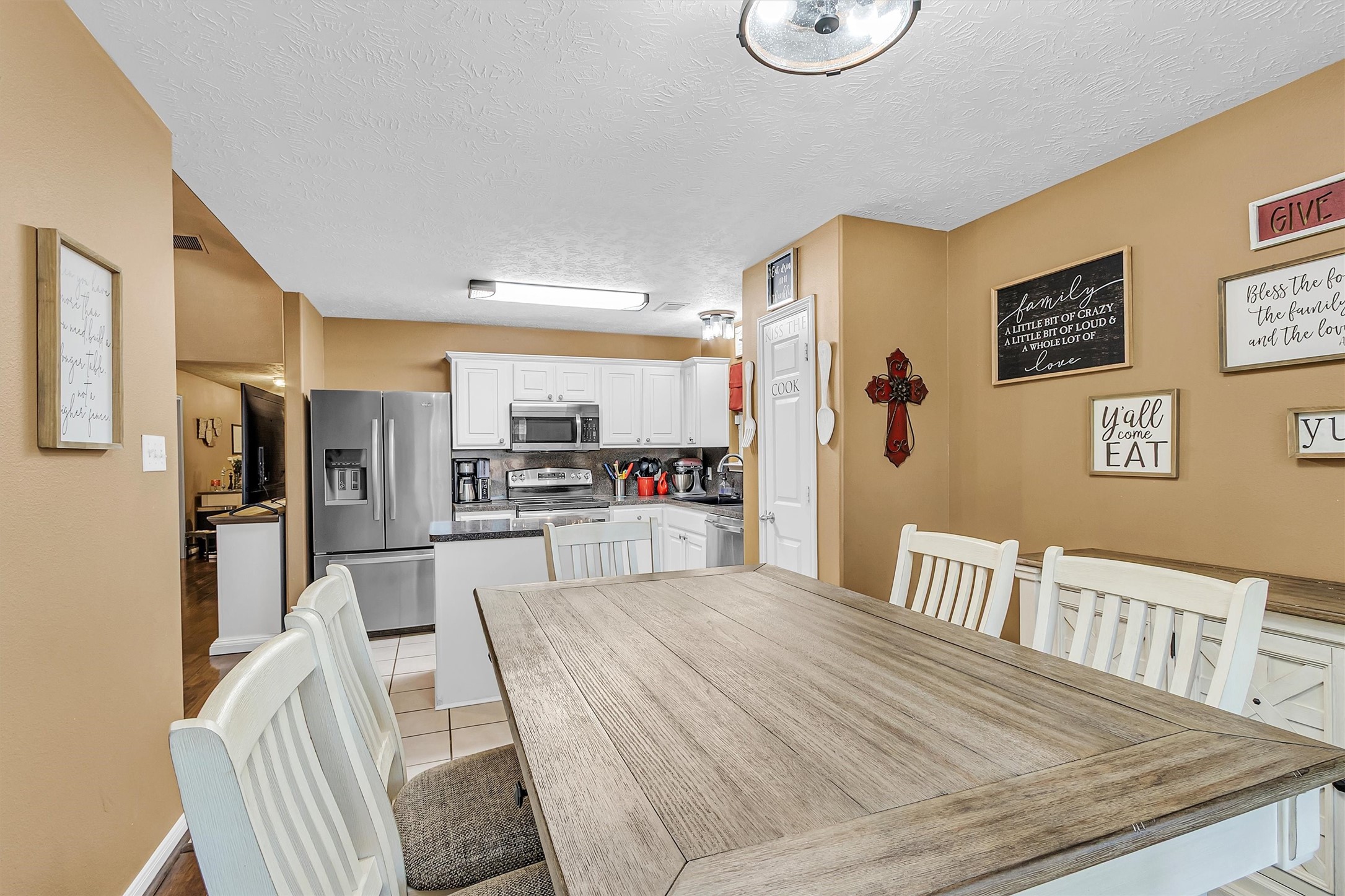 4802 Comal River Loop Spring, TX 77386 - Photo 8 of 20 Looking from the dining room towards the kitchen. This dining space easily holds a table that seats 6 plus a sideboard/cabinet.