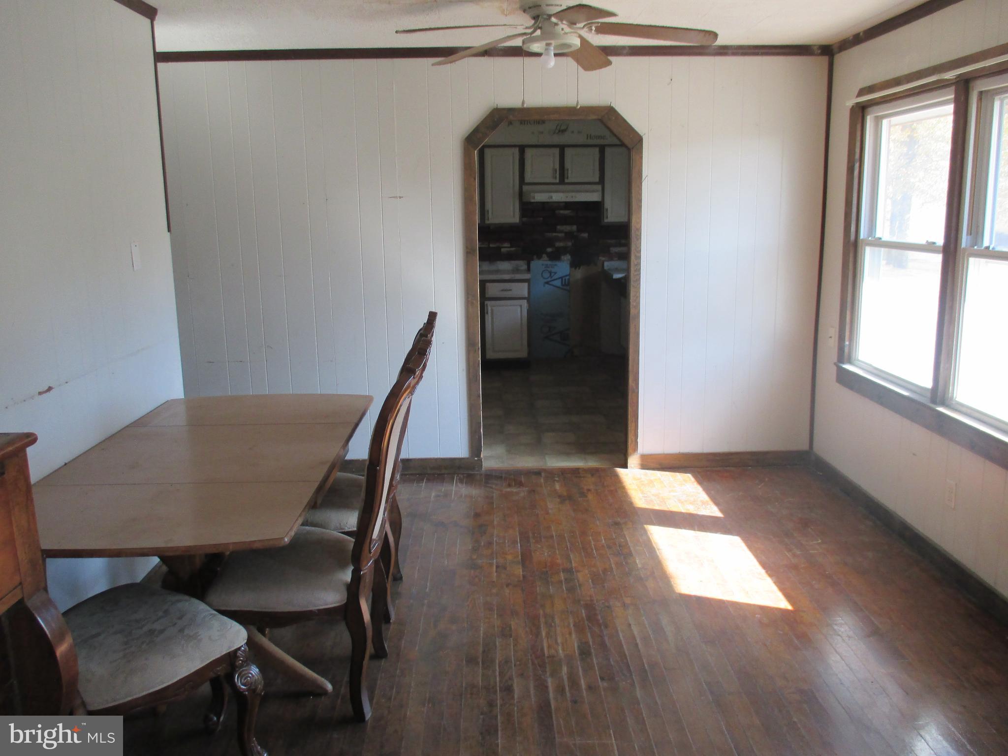 11198 Knobley Road Keyser, WV 26726 - Photo 11 of 24 a view of a room with furniture window and wooden floor