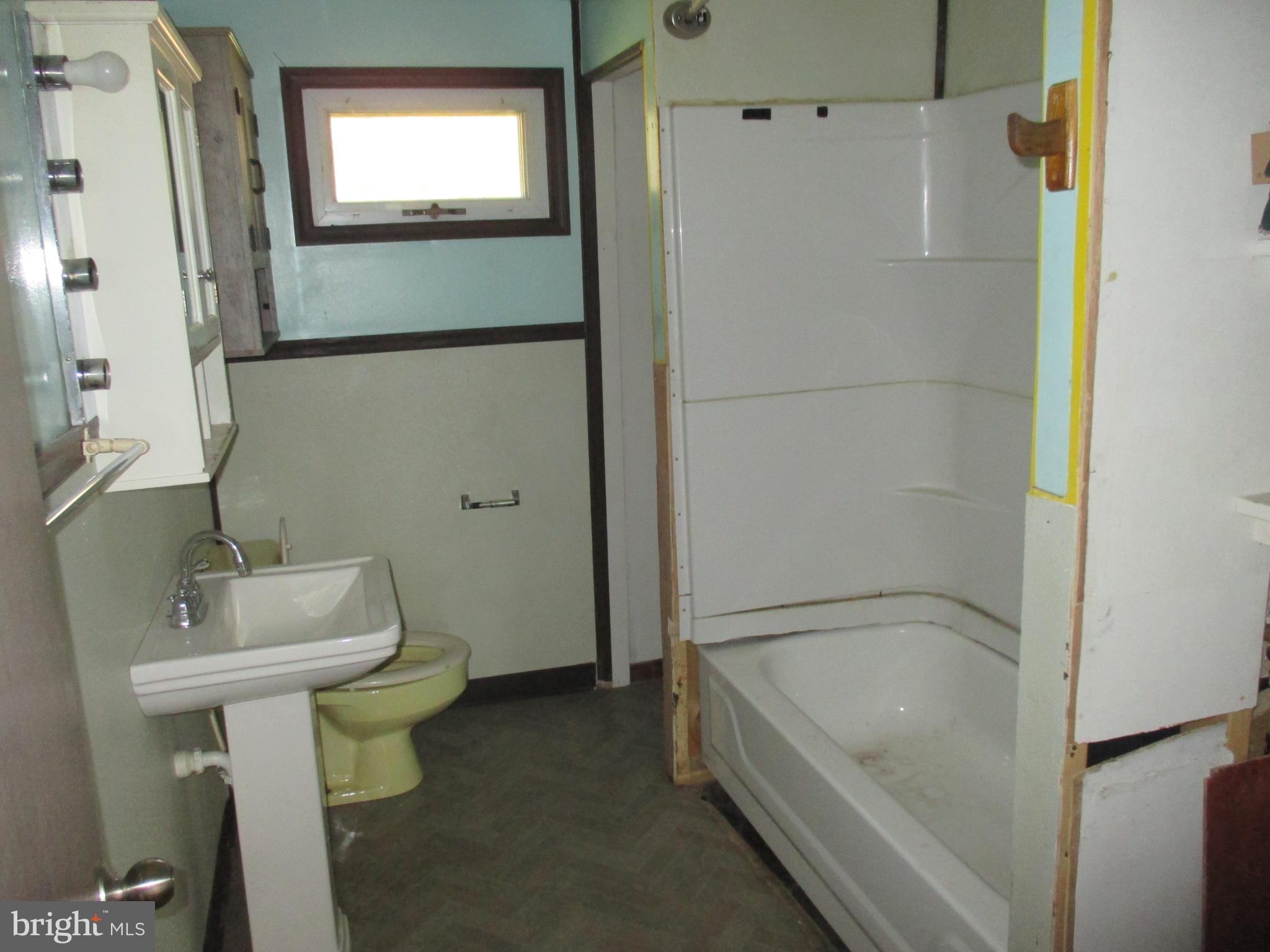 11198 Knobley Road Keyser, WV 26726 - Photo 16 of 24 a bathroom with a bathtub and a sink